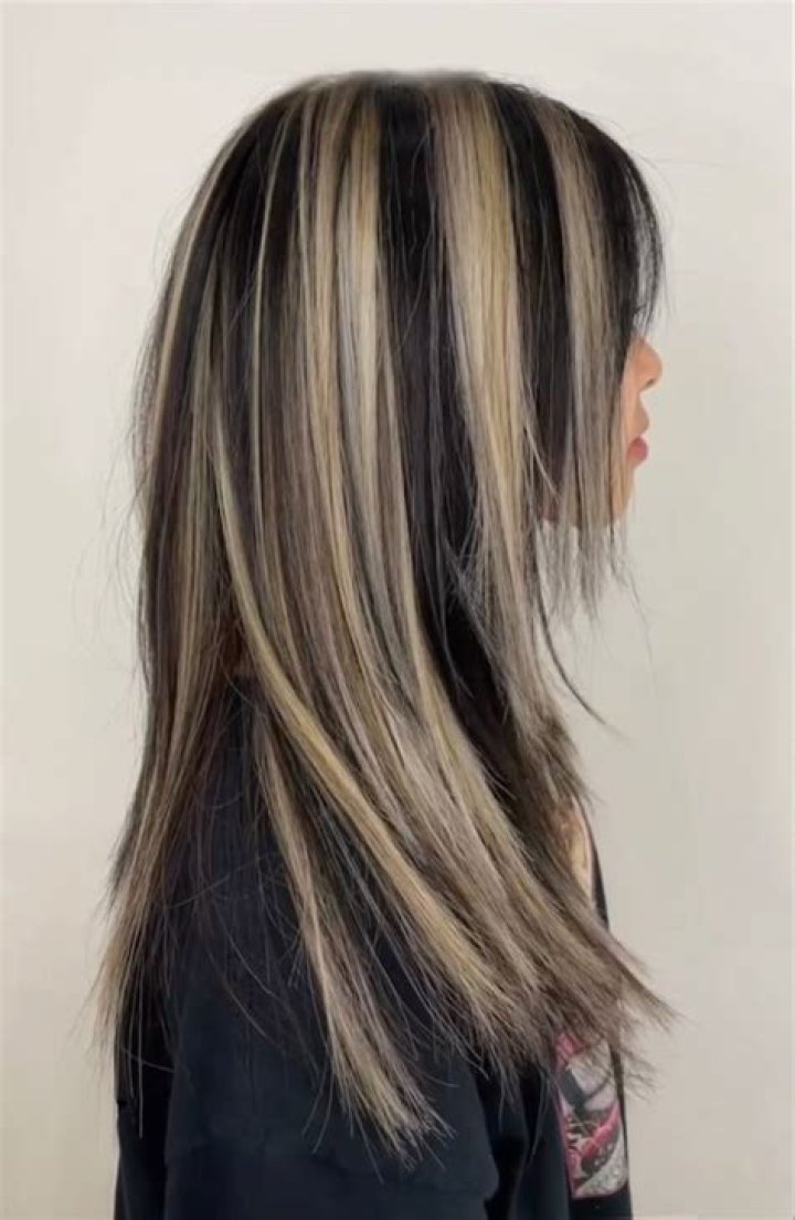 Effortlessly Chic: Black Hair with Blonde Highlights for a Striking Look